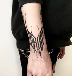 a person with a tattoo on their arm