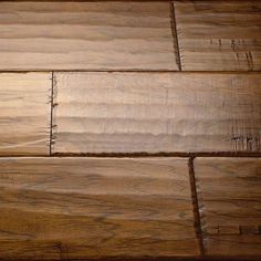 a close up view of a wooden floor with some wood grains on the surface