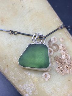 During are recent trip to the beautiful Ferris Playa beach in Spain, we collected some stunning pieces of sea glass. I was able to turn one of these pieces into a unique and beautiful pendant. The process of creating this pendant was a labor of love, and I am happy to offer it for sale at the price of $75. This pendant serves as a reminder of our memorable trip and the beauty of nature. Own a piece of our experience with this one-of-a-kind sea glass ring. Share the love for sea glass and the stu Beach In Spain, Sea Glass Gifts, Sea Glass Ring, Sea Glass Pendant, Glass Ring, Glass Rings, Sea Glass Jewelry, Share The Love, Glass Pendant