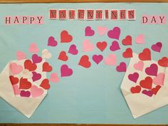 valentine's day bulletin board with paper hearts and envelopes on blue background that says happy valentine's day