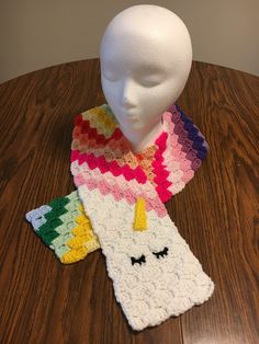 This sleepy unicorn is soft and full of color.  It is crocheted from acrylic yarn. Mini Christmas Stockings, Old Love, Louisville Ky, Rainbow Unicorn, Pansies, Hand Warmers, Acrylic Yarn, Scarf Wrap, Christmas Stockings