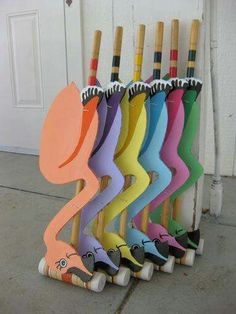 a row of colorful umbrellas sitting next to each other on top of a cement floor