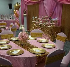 a banquet room with pink and gold decorations