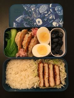 two plastic containers filled with food on top of a table