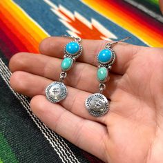 Pair of unique earrings with dangling earwire 2.25" sterling silver stamped and wrapped blue and green turquoise stones, handmade by Navajo Diné artist Burt Francisco. Photo has jewelry resting on a hand to show scale, atop a serape blanket background. Sterling silver .925 hallmark and signature 'BKF'. 3.5 grams per earring, 7 grams for pair Earrings with Earwire: 3.15" long x 0.75" wide If you have questions about this item etc please ask before you purchase. Sold as-is, no returns on vintage items. To see the whole Pioneer House selection of handmade letterpress paper goods, vintage western wear, turquoise jewelry, and accessories click here: www.etsy.com/shop/pioneerhouse Thanks for looking. Julie B. {Pioneer House of Letterpress & Vintage}  All Rights Reserved  PLEASE read my shop poli Turquoise Concho Dangle Jewelry, Blue Concho Dangle Earrings, Artisan Concho Dangle Jewelry, Bohemian Dangle Jewelry Stamped 925, Bohemian Blue Stamped Jewelry, Blue Bohemian Stamped Jewelry, Turquoise Concho Jewelry For Gifts, Bohemian Concho Dangle Jewelry, Bohemian Turquoise Jewelry With Concho