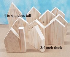 four pieces of wood are shown with measurements for the top and bottom houses on display