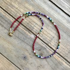 A colorful multi gemstone necklace that is as bright and beautiful as it is versatile. A convertible multi wrap stacking bracelet and layering necklace, it can be worn as a bracelet - wrapping around the wrist 3 times one day and as a necklace the next - with or without other layering necklaces. Perfect as a #Christmasgift - or for Valentine's - or a #birthdaygiftforher - or an #anniversarygift, if she likes sparkles, she'll LOVE this! Gemstones include: Red coral  Rainbow Moonstone Citrine Hessonite Garnet Peridot Canadian Jade Green Crystal Aquamarine Apatite Sapphire Rose Quartz Chariote Garnet Ruby Amethyst Labradorite Black Spinel Gold plated hematite cubes begin and end this #amazingtechnicolordreamcoat - I mean amazing technicolor convertible wrap bracelet/necklace. All findings are Adjustable Multicolor Single Strand Beaded Bracelet, Multicolor Single Strand Jewelry For Healing, Multicolor Gemstone Lariat Jewelry, Red Gemstone Beaded Bracelet Bohemian Style, Multicolor Wrap Bracelet With Round Beads And Natural Stones, Multicolor Lariat Necklace With Gemstone Beads, Multicolor Gemstone Beads Lariat Necklace, Rainbow Multi-strand Jewelry For Gifts, Red Bohemian Beaded Gemstone Bracelet