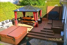 a hot tub sitting on top of a wooden deck