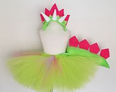 a green tutu with pink and white spikes on it