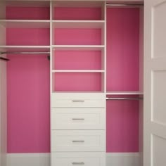 an empty closet with pink walls and white drawers