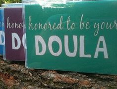 three signs on a tree that say doula and don't be afraid to be yourself