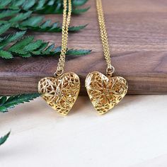 This necklace is made from a gold plated locket charm. The locket is in a shape of a simple heart and opens so you can put something special inside. The front of the locket is an intricate filigree design with cut outs. The locket hangs from a gold stainless steel chain. You can choose the style and length of the chain. Please choose the length you would like the necklace in. Please choose the chain style you would like your pendant on. Please note that all necklaces are handmade and may differ Rose Gold Heart Locket Necklace, Rose Gold Heart Pendant Locket Necklace, Heart Locket Charm Necklace Gift, Gold-plated Gold Locket Necklace Pendant, Heart Pendant Locket Charm Necklace As Gift, Gold Plated Pendant Locket Necklace, Gold-plated Pendant Locket Necklace, Gold Plated Gold Locket Pendant Necklace, Gold Round Pendant Locket Necklace With Charms