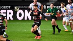 a group of men playing a game of rugby