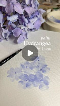 a painting with watercolors on it and purple flowers