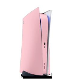 the back side of a pink computer with its door open to reveal it's screen