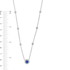 This blue sapphire and diamond station necklace adds the perfect hint of color and shimmer to your look. Sterling silver. The 5.0mm blue sapphire center stone glistens in a halo frame of diamonds. Dainty diamond stations dot the cable chain. 1/8 ct. t.w. of diamonds. 17.0-inch necklace with lobster claw clasp. Diamond Frame, Station Necklace, Cable Chain, Lobster Claw, Blue Sapphire, Halo, Sapphire, Cable, Diamonds