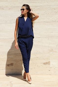 "Certainly! Here's a concise description for your formal event dark blue jumpsuit: Title: Dark Blue Two-Piece Jumpsuit - Elegant Choice Description: Elevate your style with our formal event dark blue jumpsuit, a true embodiment of sophistication and modernity. This designer jumpsuit features a sleeveless top and stylish pants, creating a stunning two-piece ensemble that's perfect for women who appreciate both elegance and comfort. Features: 🌌 Rich Dark Blue Shade 👗 Sleeveless Top for a Sleek L Sleeveless Blue Pantsuit For Summer, Chic Navy Jumpsuit For Work, Chic Blue Jumpsuits And Rompers For Work, Navy Sleeveless Fitted Jumpsuits And Rompers, Chic Navy Sleeveless Jumpsuits And Rompers, Elegant Blue Sleeveless Jumpsuits And Rompers, Jumpsuit Outfit Wedding Hijab, Navy Blue Jumpsuit Outfit Wedding, Blue Jumpsuit Outfit Wedding