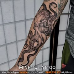 an octopus tattoo on the left arm and forearm is shown in black and grey ink