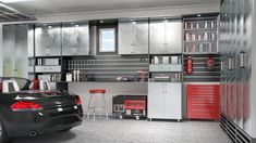 a car is parked in a garage with lots of cabinets