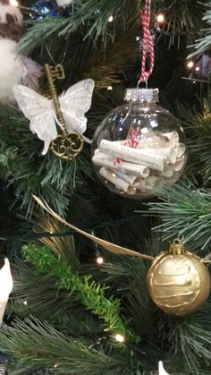 a christmas tree with ornaments hanging from it's branches