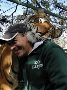 a man with a tiger on his shoulders