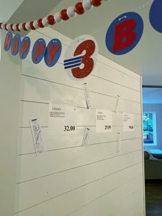 a white board with red, white and blue decorations hanging from it's sides