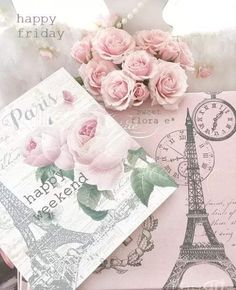 pink roses are sitting on top of an open gift box with the eiffel tower in the background