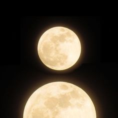 two full moon are shown in the dark sky