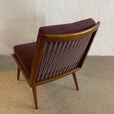 a brown chair sitting on top of a cement floor