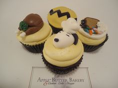 three cupcakes are decorated to look like cartoon characters