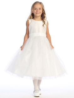 Details Lovely white dress for the holidays or a very special flower girl! Shantung bodice with sparkle tulle skirt V-back with sequins trim and bow Tea length Zipper back closure Made in U.S.A. Available in the following sizes: 2T, 3T, 4T, 5, 6, 7, 8 and 10 Made in the USA by Lito Childrens Wear Sparkle Tulle Dress, White Tea Length Dress, Tulle Dress Short, Tea Length Flower Girl Dress, Girls Heart, White Flower Girl Dresses, Tulle Flower Girl, First Communion Dresses, Tulle Flowers