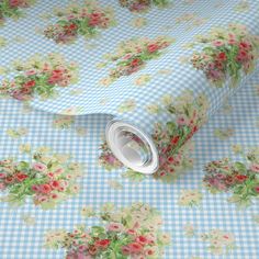 a green and white checkered wallpaper with pink flowers on the bottom half of it