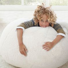 A plush slipcover makes this beanbag the softest seat in the house. Our superior-quality faux fur is as indulgent as it is beautiful. It's exceptionally woven from the finest materials for a sumptuously plush feel and beautifully emulates the inherent softness of genuine fur. GREENGUARD Gold Certified. This low-emitting product has been screened for over 10,000 chemicals and VOCs to contribute to cleaner indoor air and keep you and your family safer. Made in a Fair Trade Certified(TM) factory, s Linen Blackout Curtains, Emily And Meritt, Bean Bag Chair Covers, New Mickey Mouse, Bath Gift, Bag Chair, Faux Fur Fabric, Fur Fabrics, Pottery Barn Teen