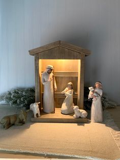 a nativity scene with figurines in the manger