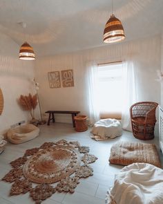 a living room filled with lots of furniture and decor on top of white tile flooring