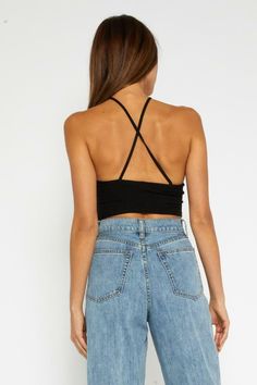 STYLE INFORMATION: Go back to basics with the Always Yours Black Cropped Halter Top! Black ribbed fabric shapes this halter neck crop top that features a handkerchief hem. Pair with jeans and white sneakers for a casual, daytime look and switch to strappy heels for a night out. DETAILS & CARE: Rayon/Spandex. Machine wash cold. Imported. SHIPPING: We offer free shipping over $100 for all orders in the Continental US.. Casual Ribbed Crop Top For Streetwear, Trendy Ribbed Halter Top For Spring, Trendy Ribbed Cropped Top, Casual Cropped Halter Top With Stretch, Casual Cropped Stretch Halter Top, Casual Stretch Cropped Halter Top, Spring Seamless Cotton Halter Top, Spring Stretch Crop Top For Streetwear, High Rise Stretch Crop Top For Spring