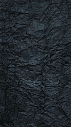 an image of wrinkled black paper background