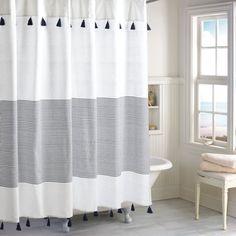 a white and black shower curtain in a bathroom