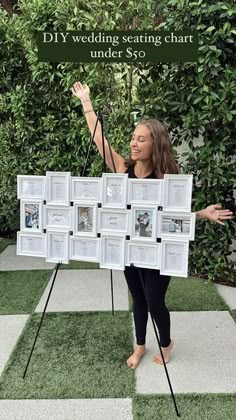 a woman standing in front of a white and black checkered floor holding up a sign that says diy wedding seating chart under $ 350