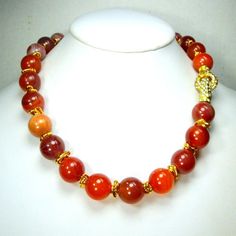 "Gorgeous Dark Carnelian Bead Necklace w Magnetic Rhinestone Focal Catch and Gold Wire Wrap Separators NOW on Sale From $48 to $39.95 These BIG carnelian beads are 13mm or 1/2\" Gem Quality The magnetic catch necklace is 17\" long ( 43.18cm ) Polished semi-precious Earth's gems, mother nature's mineral bounty necklace in Stunning dark rusty red carnelian agates with all kinds of stripes and markings even tonal variants hinged rhinestone magnetic focal catch can be worn anywhere !! front side bac Carnelian Beaded Necklaces With Round Stones, Carnelian Beaded Necklaces With Stones, Hand Knotted Necklace, Red Carnelian, Stone Beaded Necklace, Vintage Necklaces, Carnelian Beads, Beaded Dangle Earrings, Resin Beads