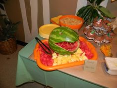 a watermelon carved to look like a shark with its mouth open