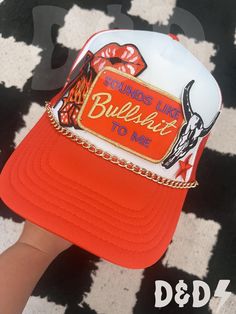 This custom made trucker patch hat is perfect for any occasion whether it be for spring/summer time, a lake hat, a gift for someone, or just a cute accessory to add a little spice to your outfit 🧢✨ DETAILS-  * This hat is one size with an adjustable SnapBack that is adjustable from 20in. - 23.5in. * The color of this hat is Red White * The material of the hat is polyester with iron on patches  REFUNDS AND CANCELLATIONS- Every hat is handmade by me as a result, a slight variation can occur from the picture with patch size or placement. If you have any problems with your hat please message me within 24 hours of receiving your order and I'd be happy to help! No refunds or exchanges will be accepted after. CONNECT- To enter giveaways, discount codes, or behind the scenes, follow our pages. 📲 Red Trucker Hat For Rodeo, Red Snapback Trucker Hat For Rodeo, Fun Orange Snapback Hat, Red Trucker Hat For Festival, Trendy Orange Trucker Hat One Size Fits Most, Trendy Orange Trucker Hat One Size, Snapback Baseball Cap For Rodeo In Summer, White Patches Hat For Summer, Trendy Orange Trucker Hat