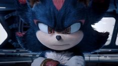 sonic the hedgehog from sonic the hedgehog is looking into the distance with his eyes wide open