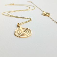 Round Spiral necklace, made of high-quality 14k gold plated chain. Dainty necklace appropriate for both everyday or special looks.  Spiral is the symbol of infinity and eternal existence.  Ideal anniversary gift! Also available in 925 Sterling Silver option.  Complete the set:  https://www.etsy.com/listing/1104147517/spiral-bracelet-bracelet-in-14k-gold?click_key=7ef248893cbaf975dd7625d86705068a8dbea0d2%3A1104147517&click_sum=afbaa32d&ref=shop_home_active_8&pro=1&frs=1 https://www.etsy.com/listi Handmade Spiral Yellow Gold Jewelry, Spiral Yellow Gold Necklace For Gift, Spiral Gold-plated Jewelry, Gold Plated Spiral Jewelry, Spiral Brass Necklace For Gift, Adjustable Spiral Gold Necklace, Adjustable Gold Spiral Necklace, Gold Spiral Necklace As A Gift, Gold Spiral Necklace For Gift