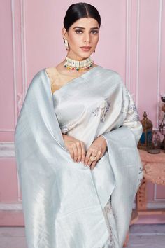 Beautiful powder blue floral Banarasi saree with zari border and pallu is a perfect drape for festive occasions. It comes with a blouse piece. Disclaimer: The shown stitched blouse on the model is for display purpose only. The saree comes with a matching blouse piece and finished with fall and piko. Latest Designer Sarees, Fashion Journals, Banarasi Saree, Traditional Fabric, Saree Online, Banarasi Sarees, Sarees Online, Powder Blue, Blouse Dress