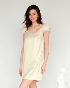 An elegant and minimalist dress made of satin, complemented by detachable straps with soft feathers, look romantic and at the same time very comfortable. We would be glad to assist you with choosing the right size and even use your individual measurements so that the product fits you perfectly, at no additional cost. Details: Contains: Dress, Detachable Straps Material: Satin Lining: Satin Length: Short, Long Hardware: Hypoallergenic Stainless Steel Colour: Almond Milk, Nude Collection: Silenzio Elegant Wedding Night Dress With Feather Trim, Elegant Feather Trim Dress For Wedding Night, Cream Elegant Sleep Dress, Satin Dresses With Feather Trim, Elegant Dresses With Feather Trim And Spaghetti Straps, Feathered Dresses For Wedding Night, Minimalist Dress, Garment Care Labels, Minimalist Dresses