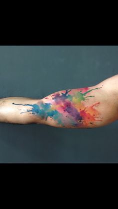 the arm is covered with colorful ink