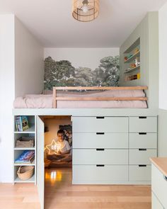 there is a loft bed in the corner of this room, with drawers underneath it