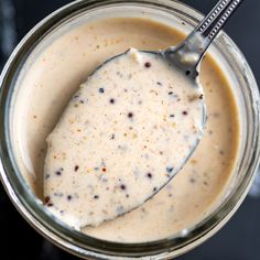 a spoon in a jar filled with liquid