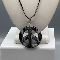 "Dichroic Art Glass Peace Sign Pendant, Black White and Silver Swirl on Black Bead Chain Necklace, Long and Dramatic Whimsigoth Statement Measurement * 36\" strand; 2\" pendant 18K White Gold Plate Bale Condition * Very nice Condition. Gently Used. Size: Unisex 36\" Condition: Pre-Owned Good" Artistic Black Adjustable Necklace, Black Wire Wrapped Jewelry For Festival, Gothic Adjustable Round Necklace, Gothic Round Adjustable Necklace, Artistic Black Jewelry For Festival, Black Spiritual Nickel-free Necklace, Nickel-free Black Spiritual Necklaces, Black Nickel-free Spiritual Necklaces, Nickel-free Black Spiritual Necklace